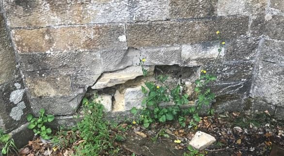 Damage to the fountain structure requiring urgent repair